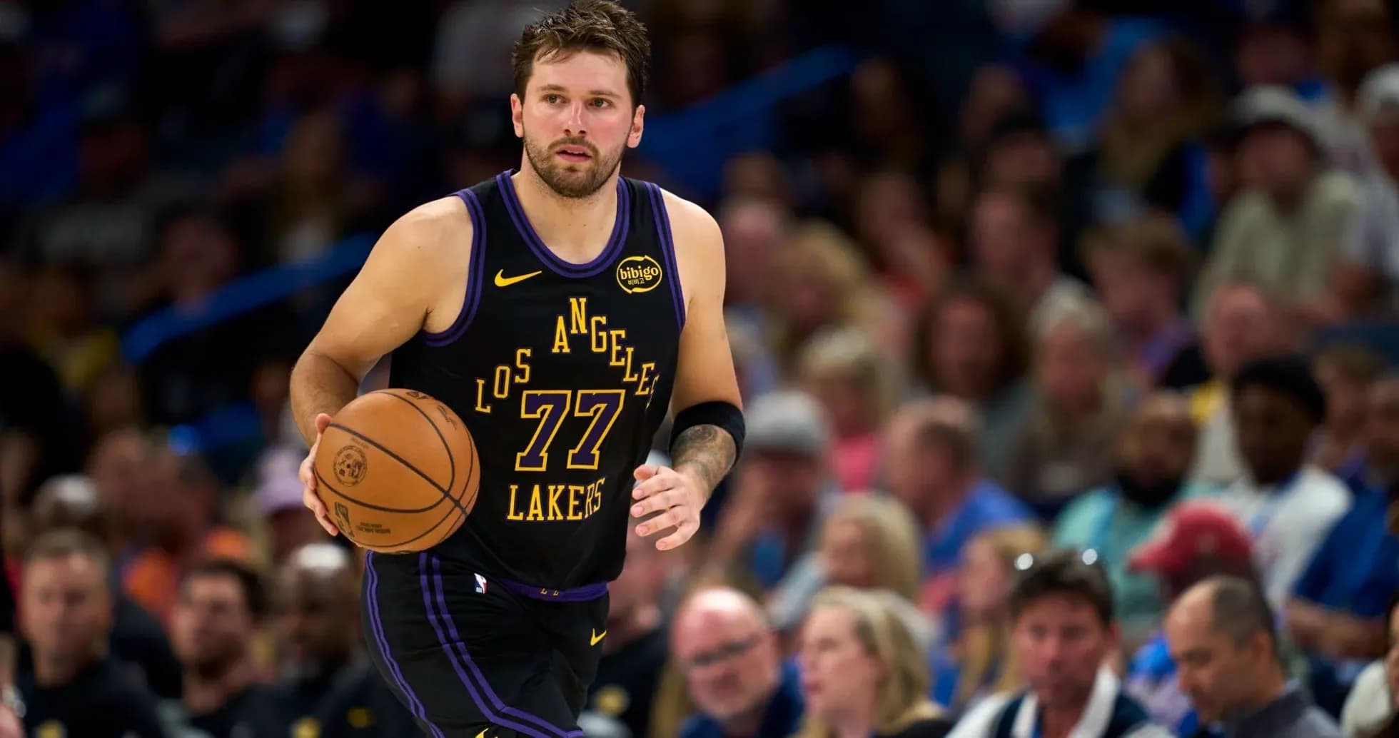 Player dribbling basketball during a game Player dribbling basketball during a game