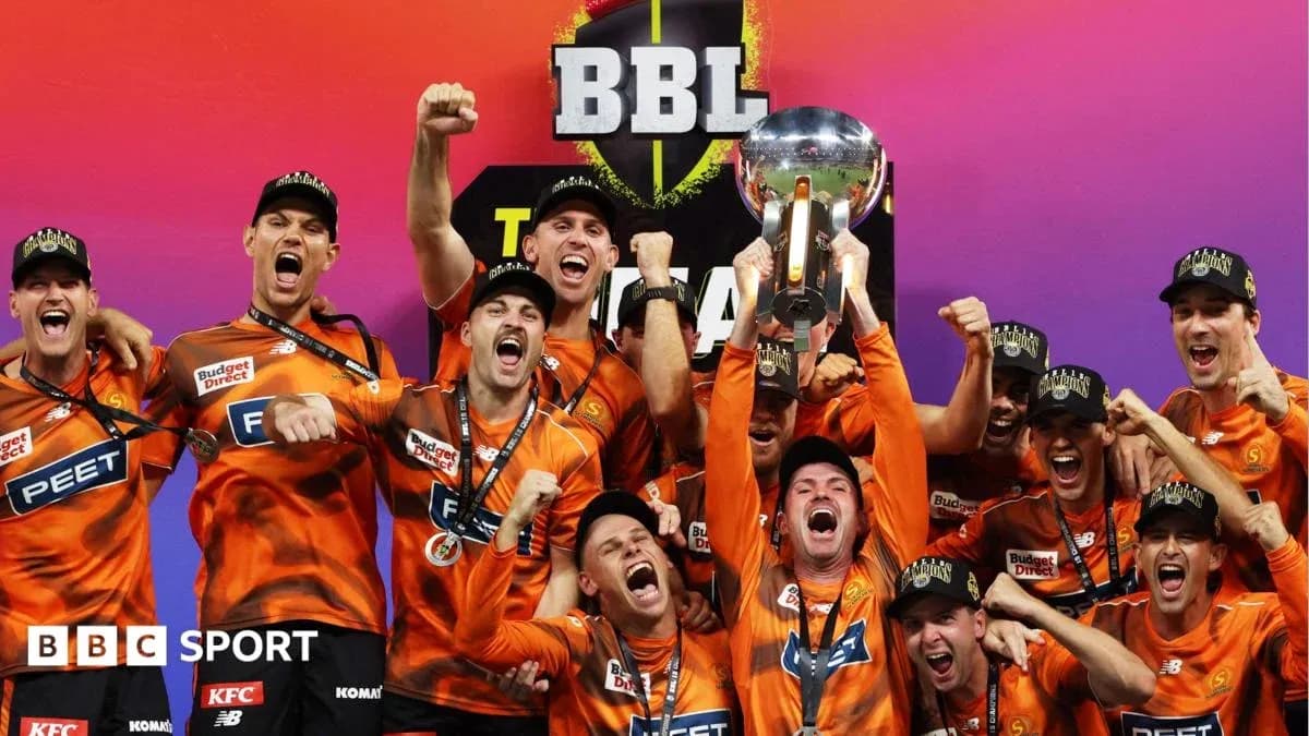 Team celebrating with trophy after BBL championship win Team celebrating with trophy after BBL championship win