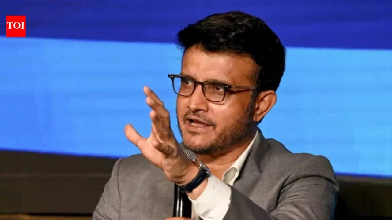 Person speaking at an event with a microphone Person speaking at an event with a microphone