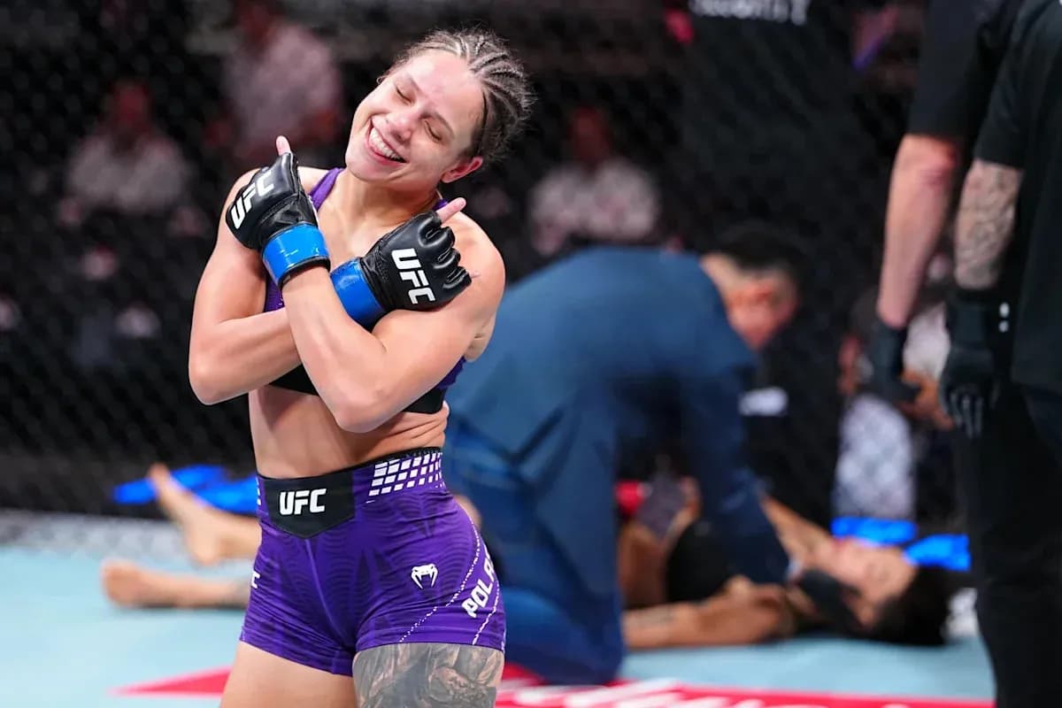 Fighter celebrating victory in the octagon Fighter celebrating victory in the octagon