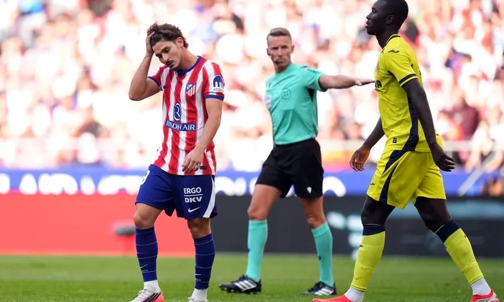 Atletico Madrid player reacts after a foul call Atletico Madrid player reacts after a foul call