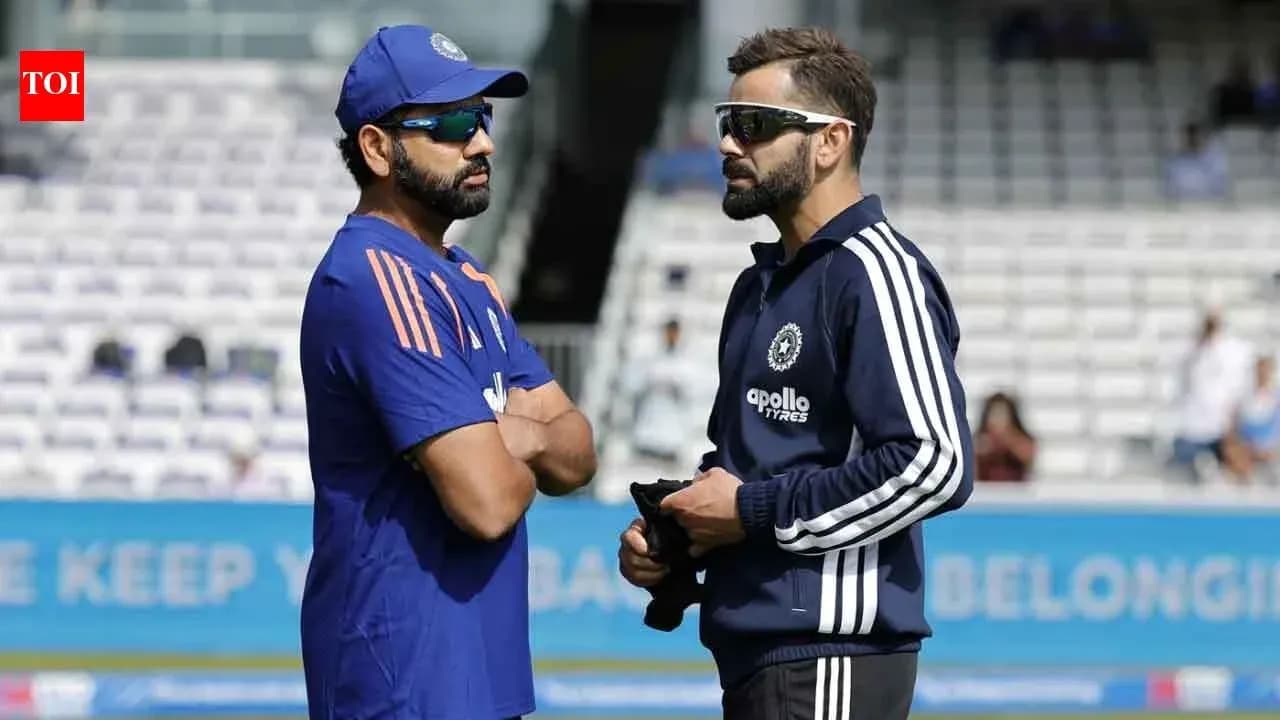 Rohit Sharma and Virat Kohli talking on the field Rohit Sharma and Virat Kohli talking on the field