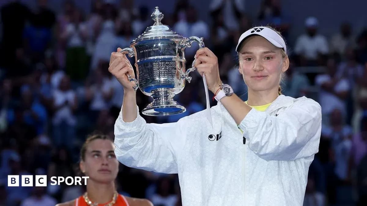 Player holding trophy after winning tennis match Player holding trophy after winning tennis match