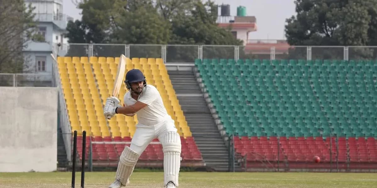 Batsman preparing to hit ball in cricket match Batsman preparing to hit ball in cricket match