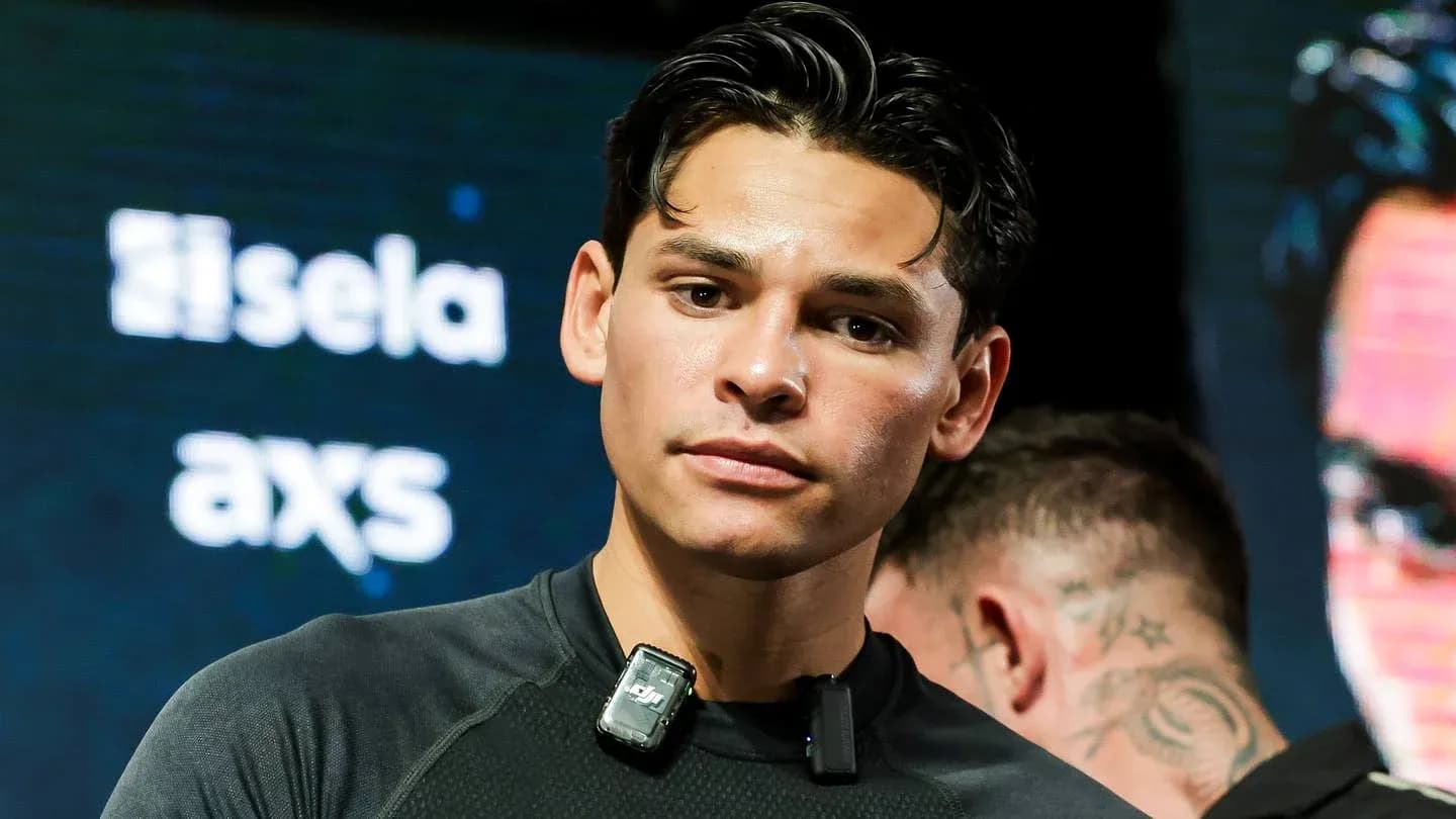 Boxer preparing for an event with microphones attached Boxer preparing for an event with microphones attached
