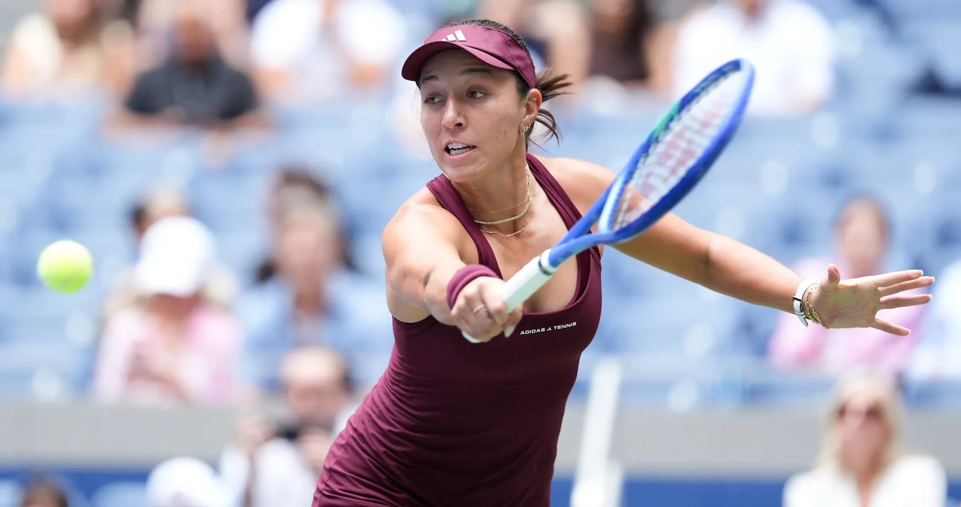 Player hitting a tennis ball during a match Player hitting a tennis ball during a match