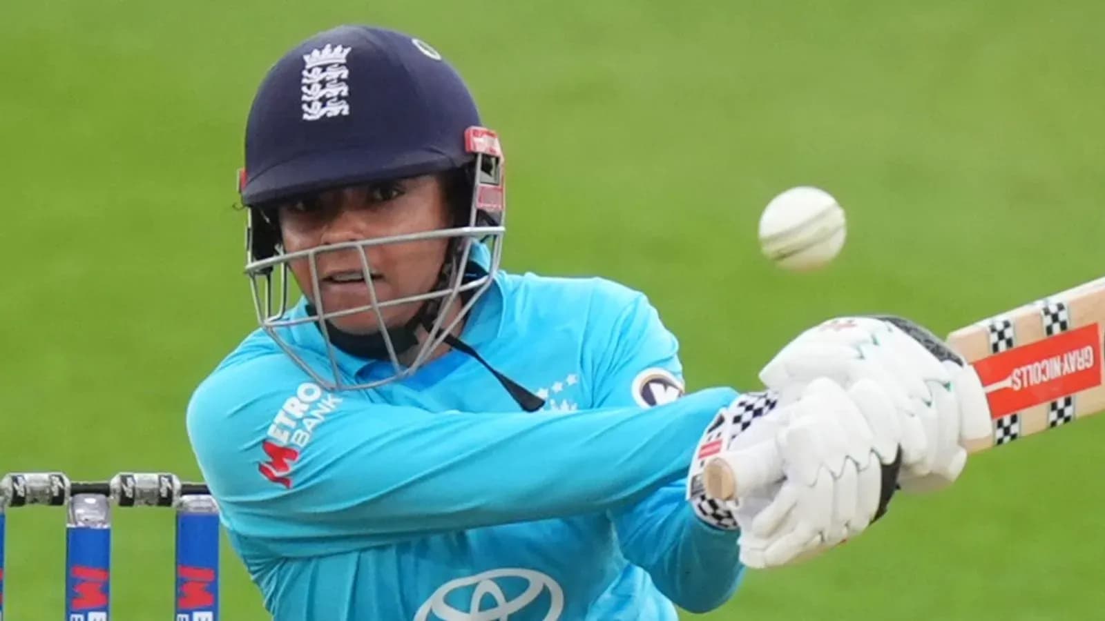 Cricketer batting while facing a delivery Cricketer batting while facing a delivery
