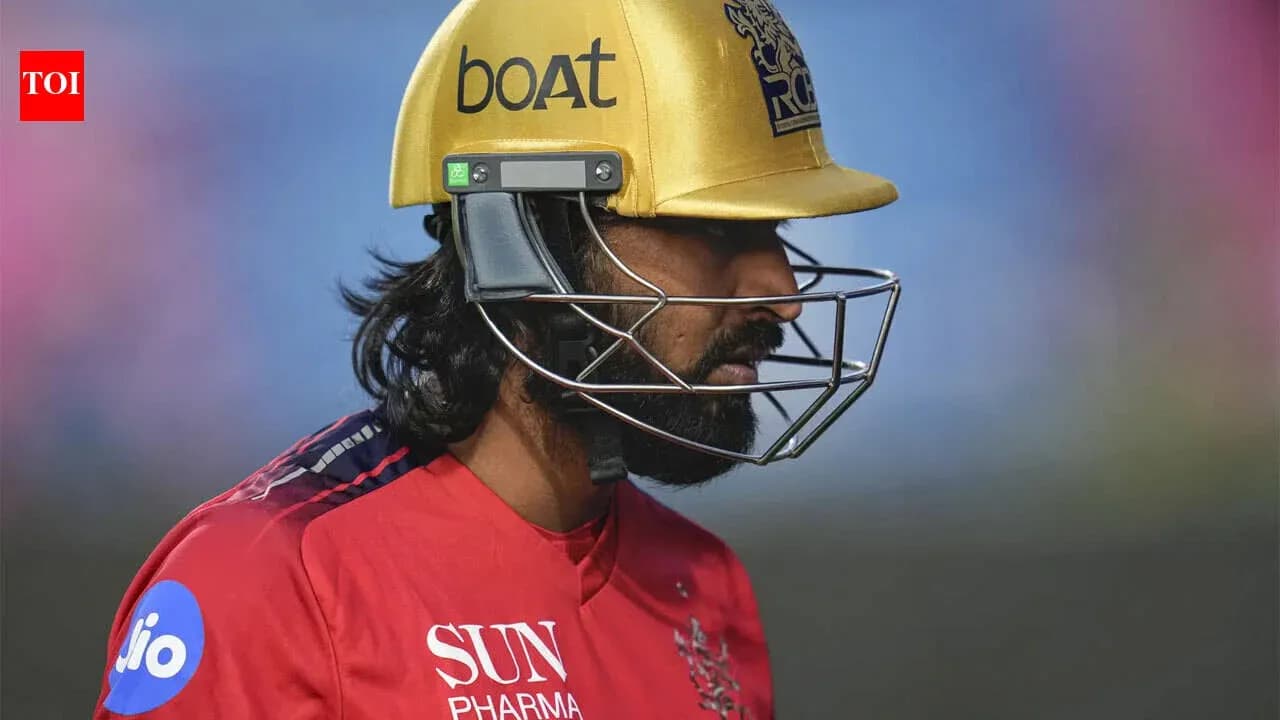 Cricketer wearing a helmet during a match Cricketer wearing a helmet during a match