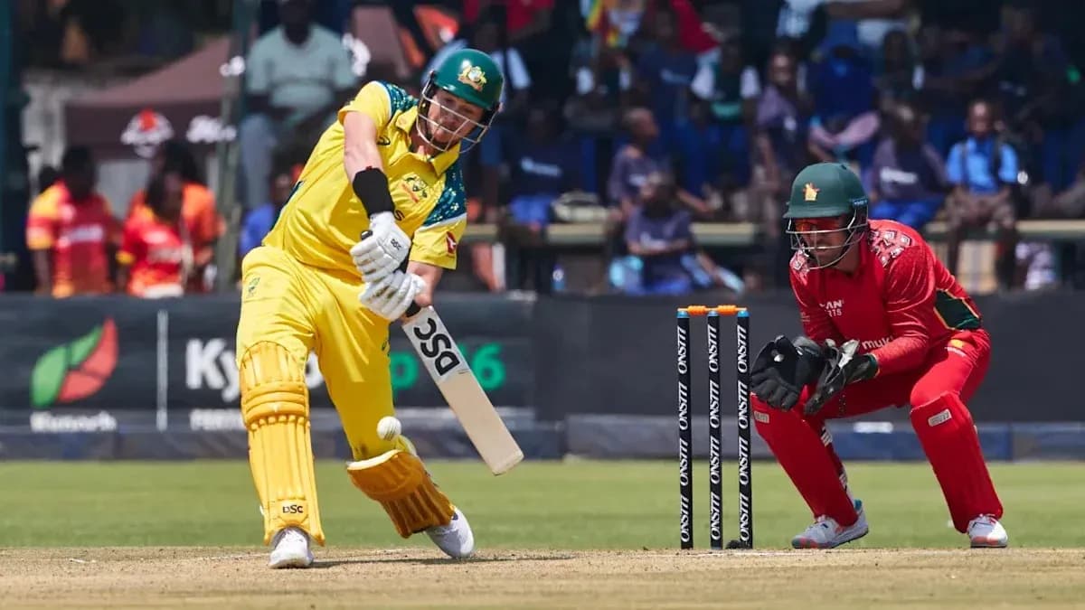 Batsman hitting the ball with wicketkeeper behind Batsman hitting the ball with wicketkeeper behind