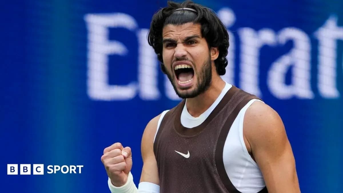 Tennis player celebrating with fist pump on court Tennis player celebrating with fist pump on court
