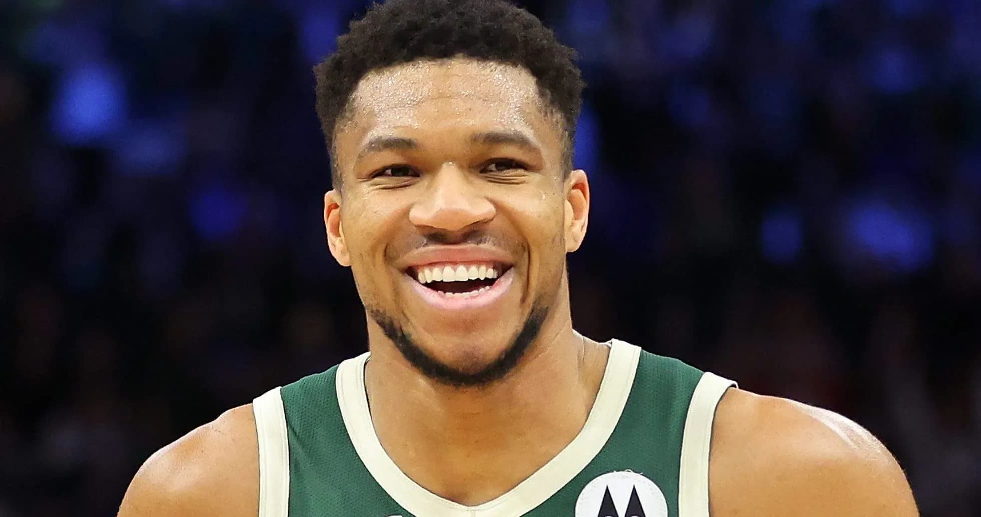 Player smiling in Milwaukee Bucks jersey Player smiling in Milwaukee Bucks jersey