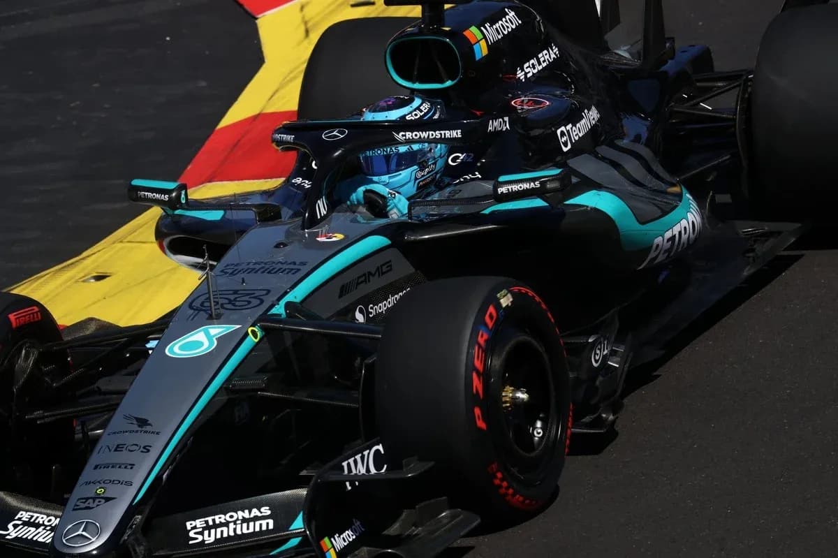 Mercedes Formula 1 car navigating a track corner Mercedes Formula 1 car navigating a track corner