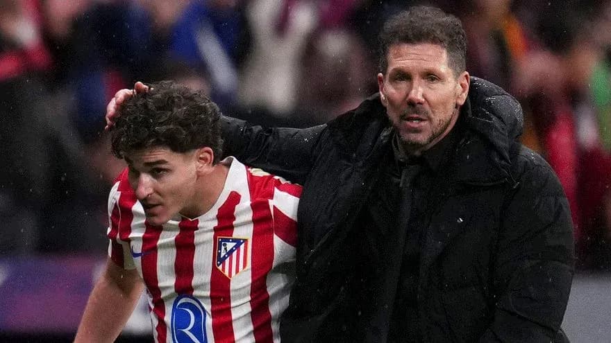 Atletico Madrid player and coach on the sidelines Atletico Madrid player and coach on the sidelines