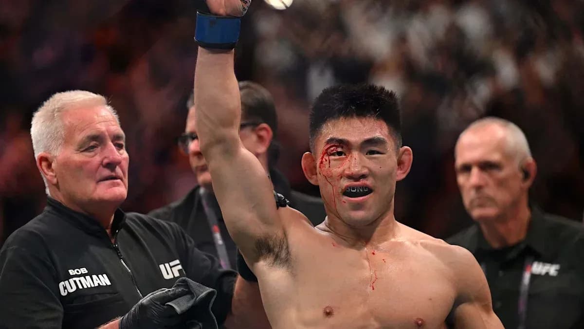 Fighter celebrating victory with a bloodied face Fighter celebrating victory with a bloodied face