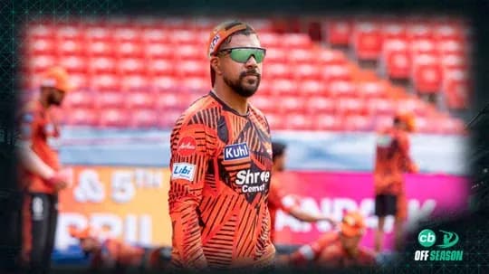 Player in orange jersey during practice session Player in orange jersey during practice session