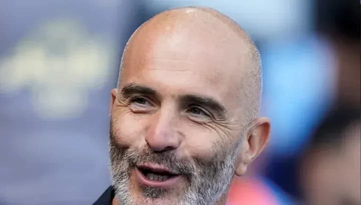 Man with a bald head and beard smiling Man with a bald head and beard smiling