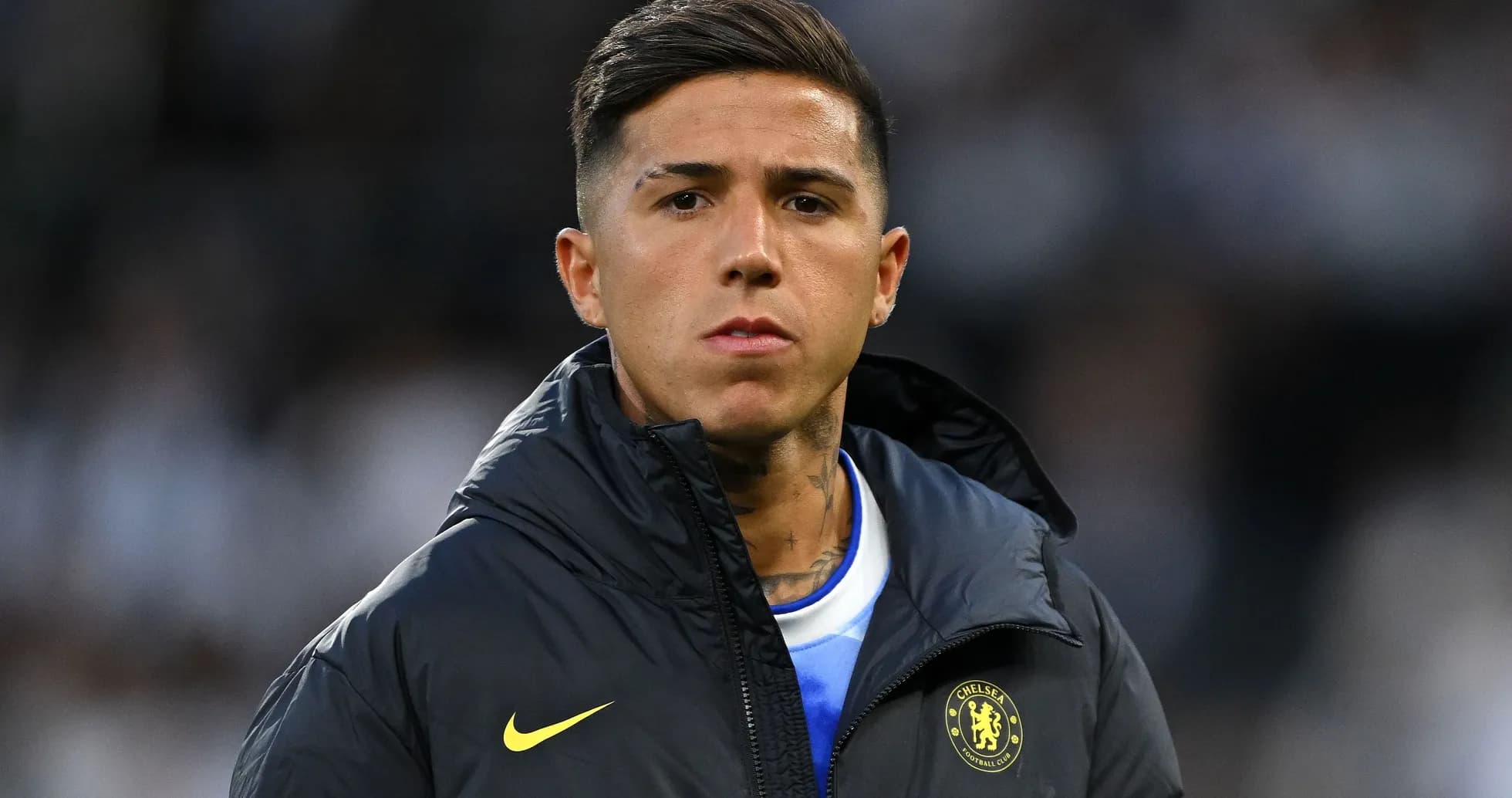 Player in Chelsea jacket on the sidelines Player in Chelsea jacket on the sidelines