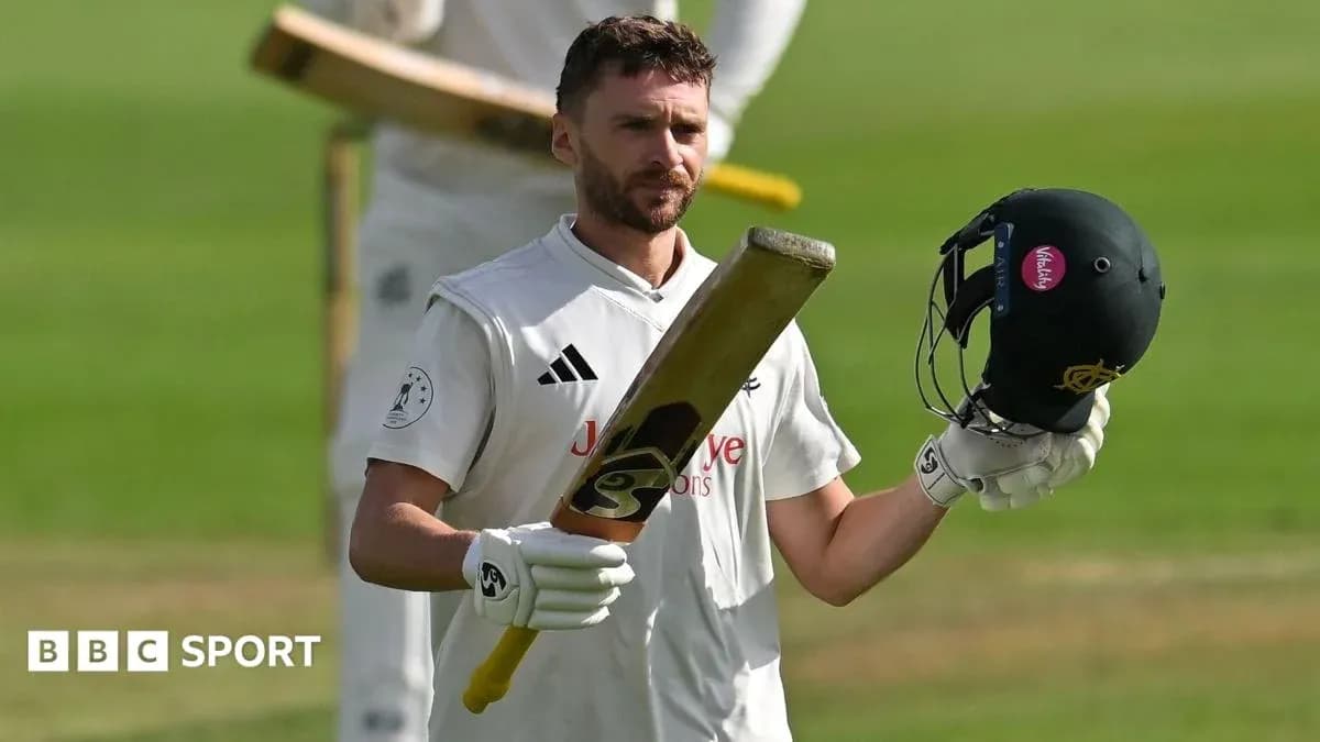 Batsman raising bat and helmet after innings Batsman raising bat and helmet after innings