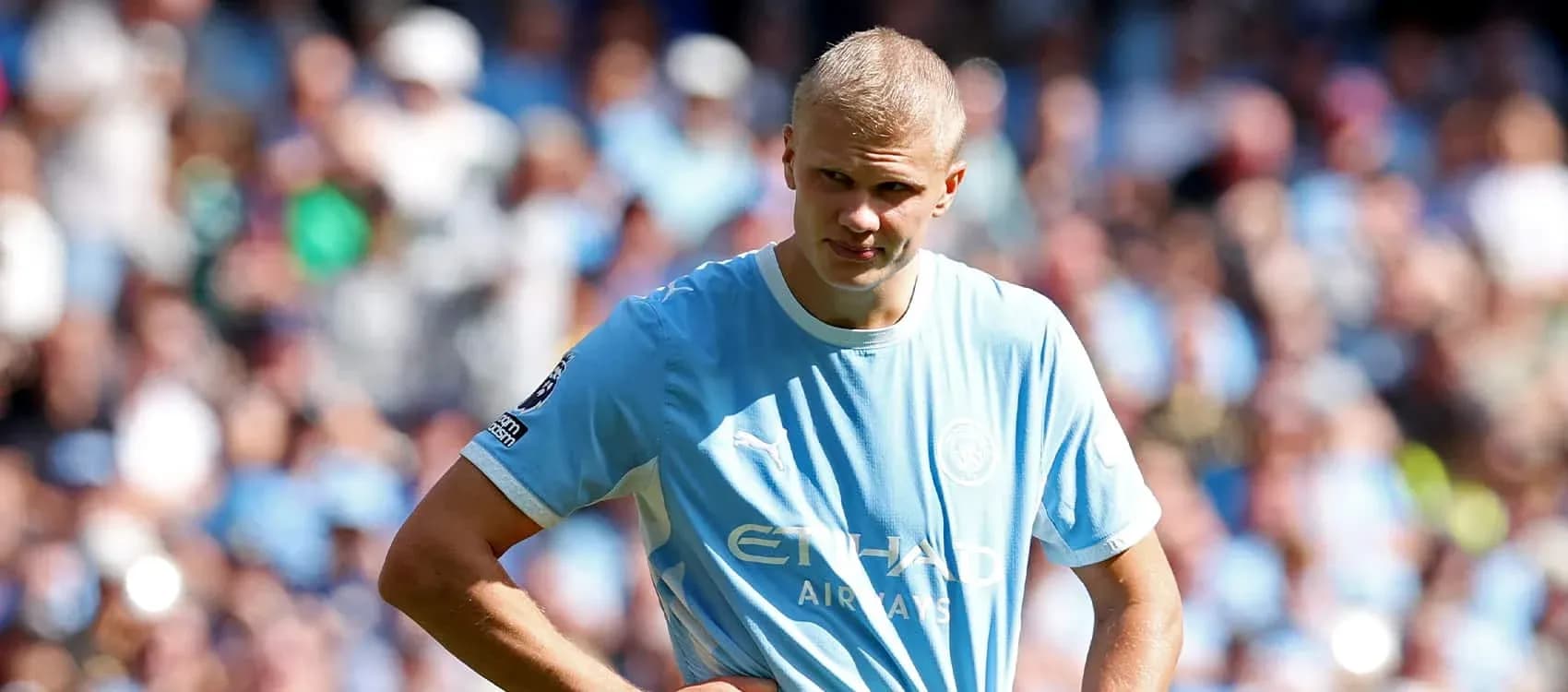 Player in light blue jersey during match action Player in light blue jersey during match action