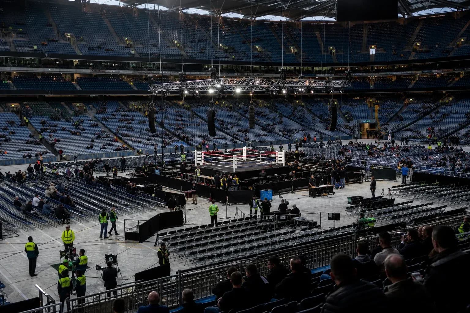 Empty boxing ring set up in large stadium Empty boxing ring set up in large stadium