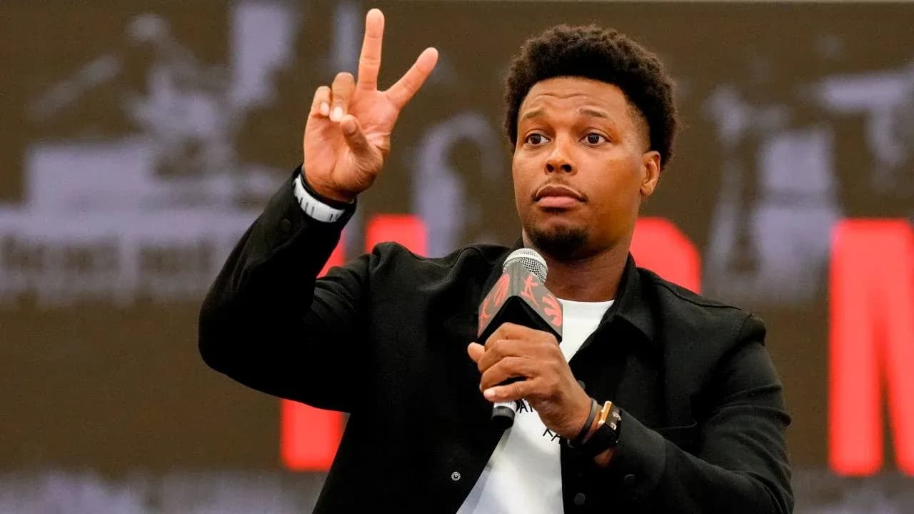 Player gesturing with peace sign at podium Player gesturing with peace sign at podium