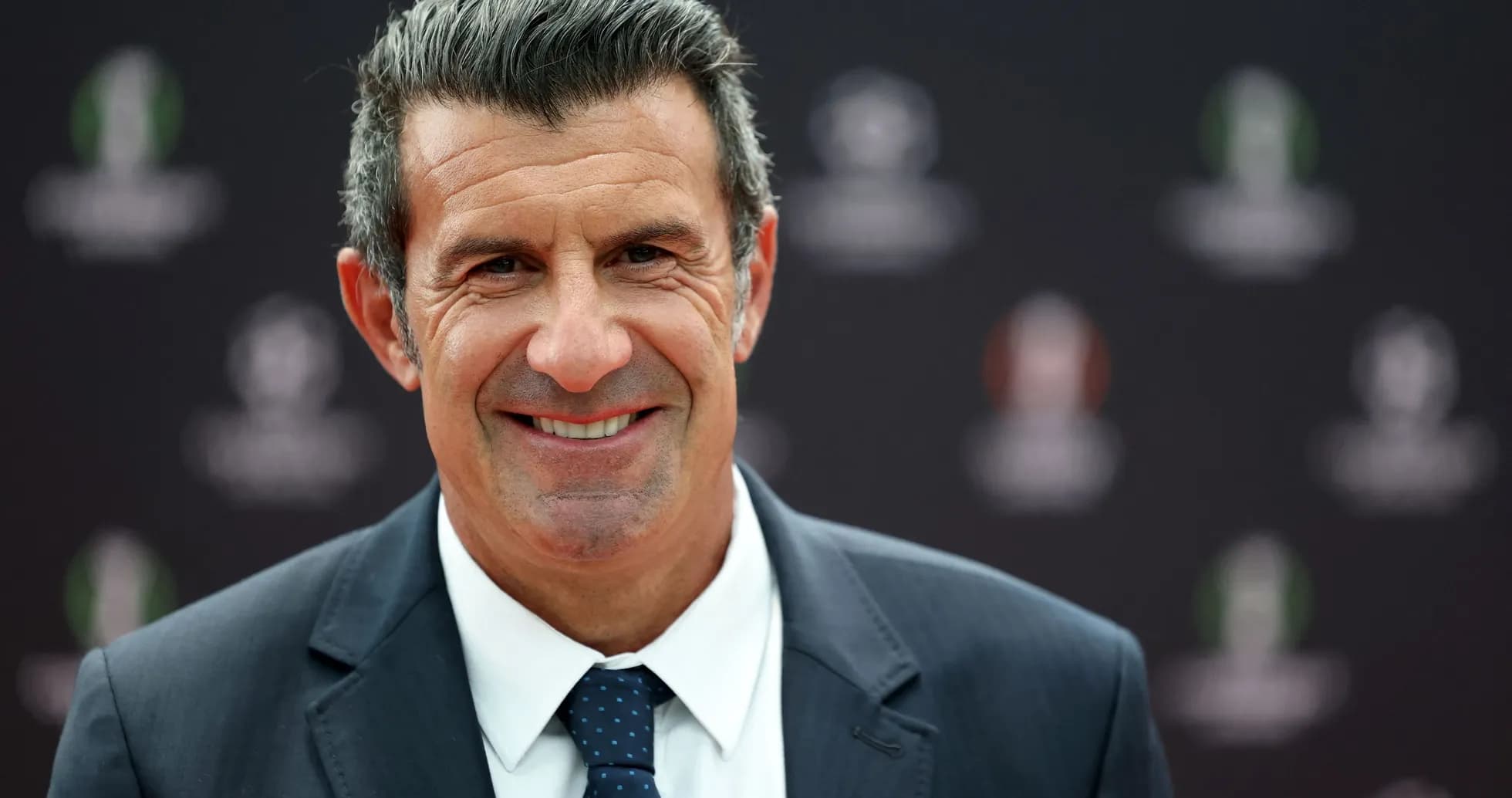 Smiling man in a suit at an event Smiling man in a suit at an event
