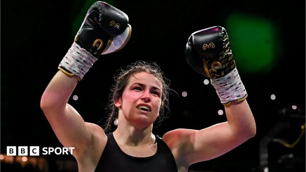Boxer celebrating victory with raised gloves in ring Boxer celebrating victory with raised gloves in ring
