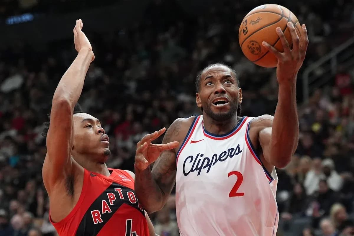 Kawhi Leonard shooting while guarded by opponent Kawhi Leonard shooting while guarded by opponent