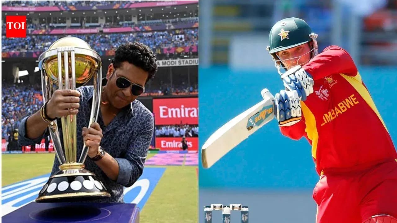 Sachin Tendulkar holding a cricket trophy, player batting Sachin Tendulkar holding a cricket trophy, player batting