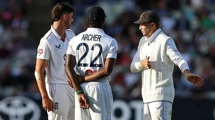 Players discussing strategy during cricket match Players discussing strategy during cricket match