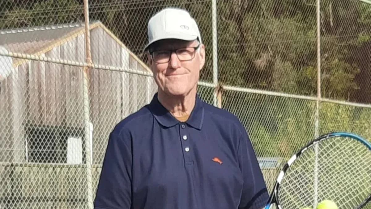 Man holding tennis racket on court Man holding tennis racket on court