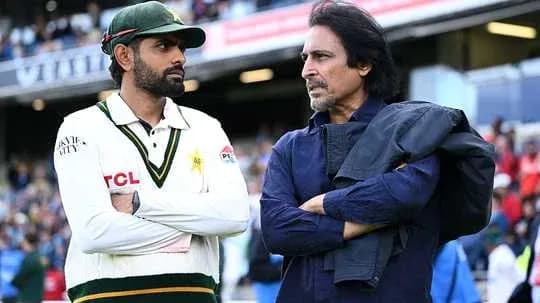 Two men discussing on cricket field sidelines Two men discussing on cricket field sidelines