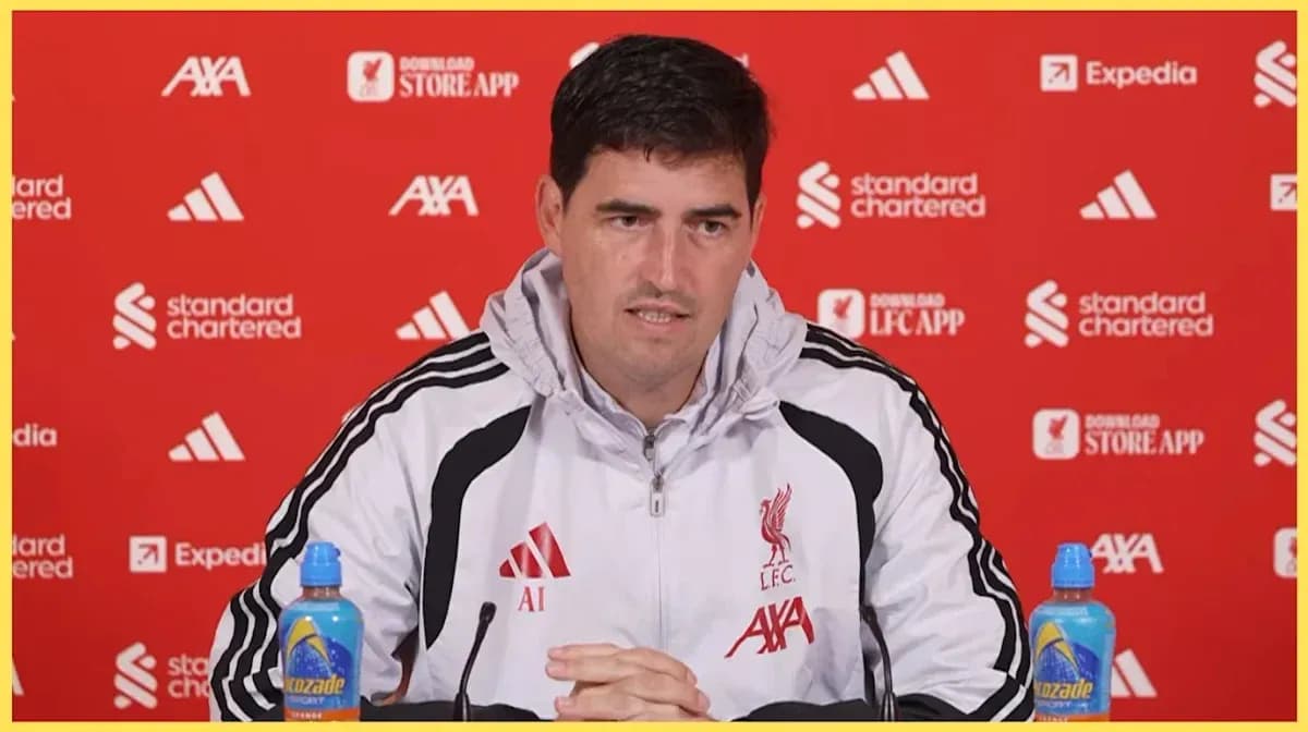 Manager speaking at press conference with Liverpool backdrop Manager speaking at press conference with Liverpool backdrop