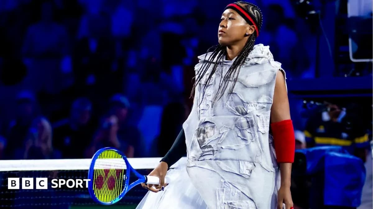 Naomi Osaka walking onto court with tennis racket Naomi Osaka walking onto court with tennis racket