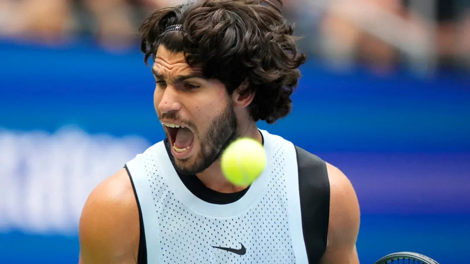 Player hitting a tennis ball during a match Player hitting a tennis ball during a match