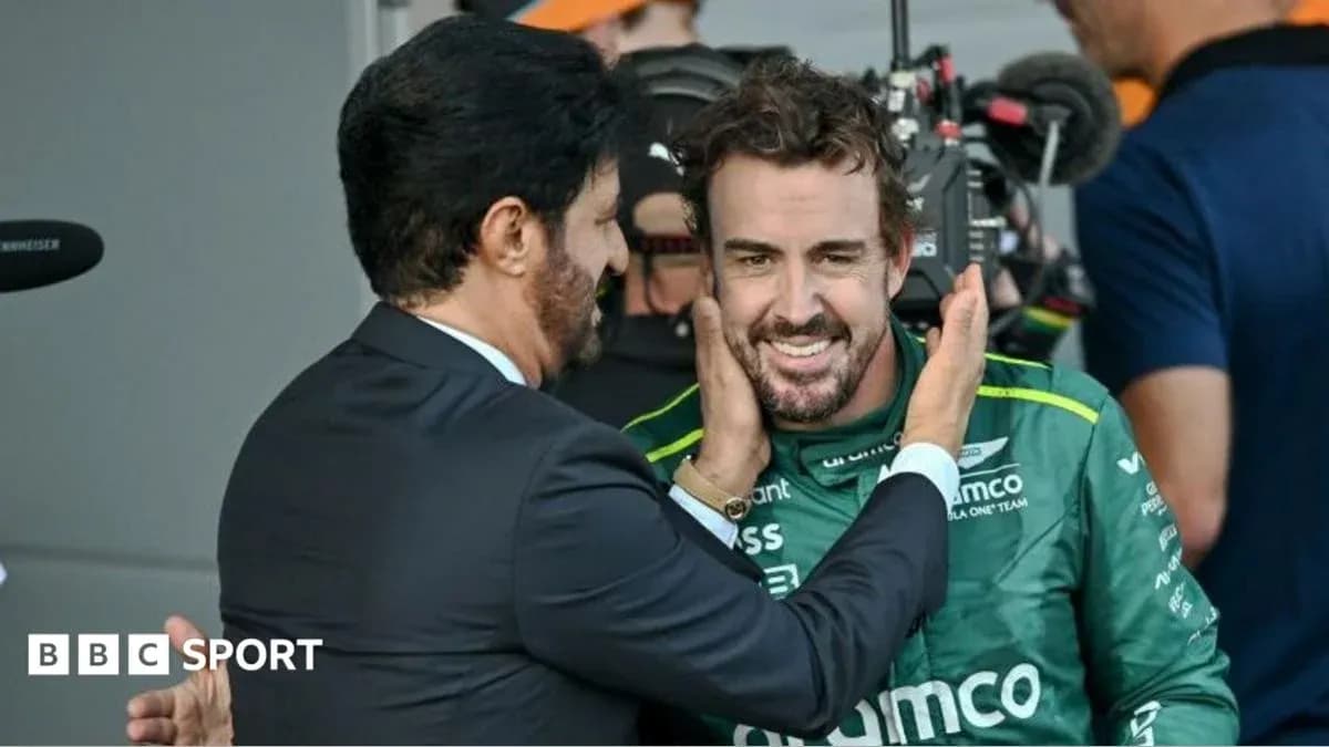 Two men interacting in a pit lane after race Two men interacting in a pit lane after race
