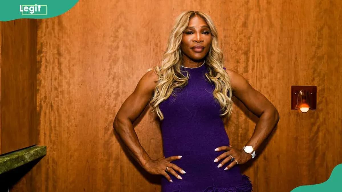 Athlete posing confidently in a purple dress Athlete posing confidently in a purple dress