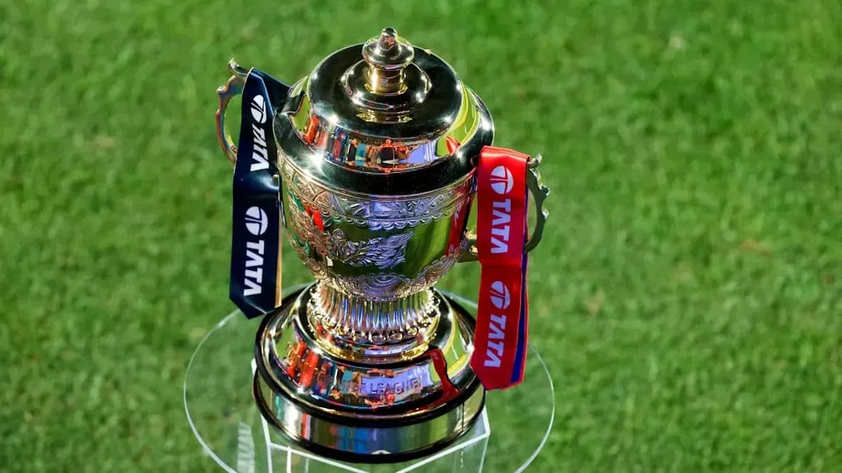 Trophy displayed on a pedestal on grass Trophy displayed on a pedestal on grass