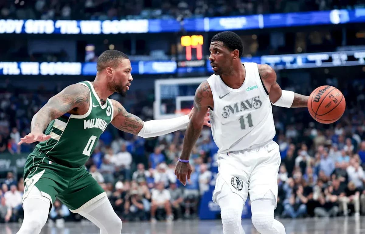 Player dribbling the ball while being guarded Player dribbling the ball while being guarded