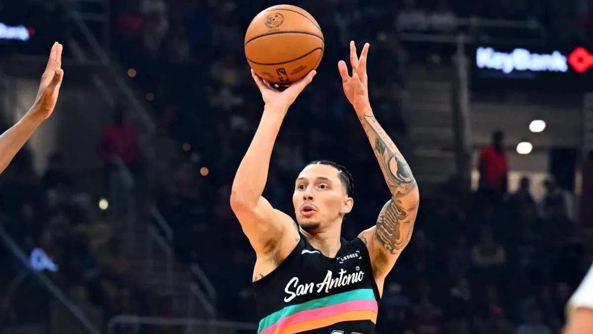 Player shooting basketball during a game Player shooting basketball during a game