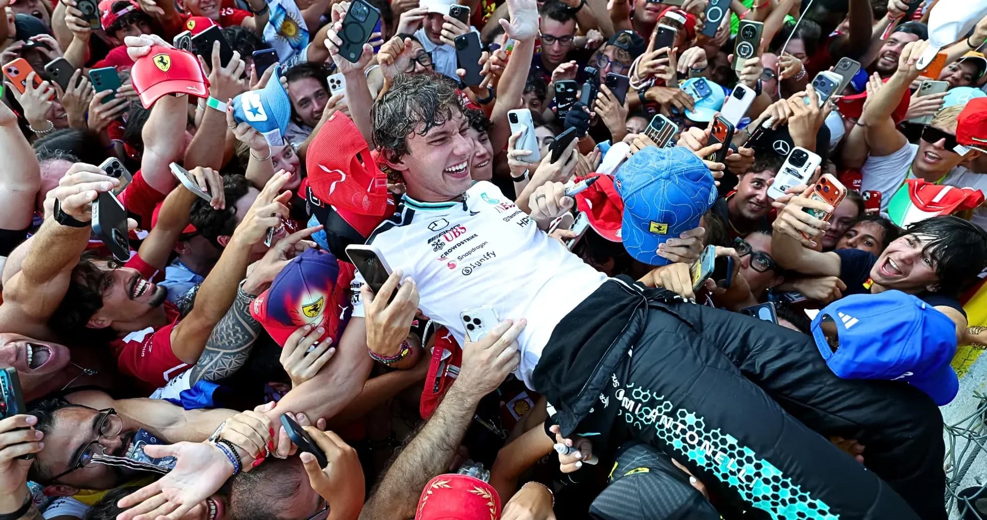 Driver celebrating with fans after the race Driver celebrating with fans after the race