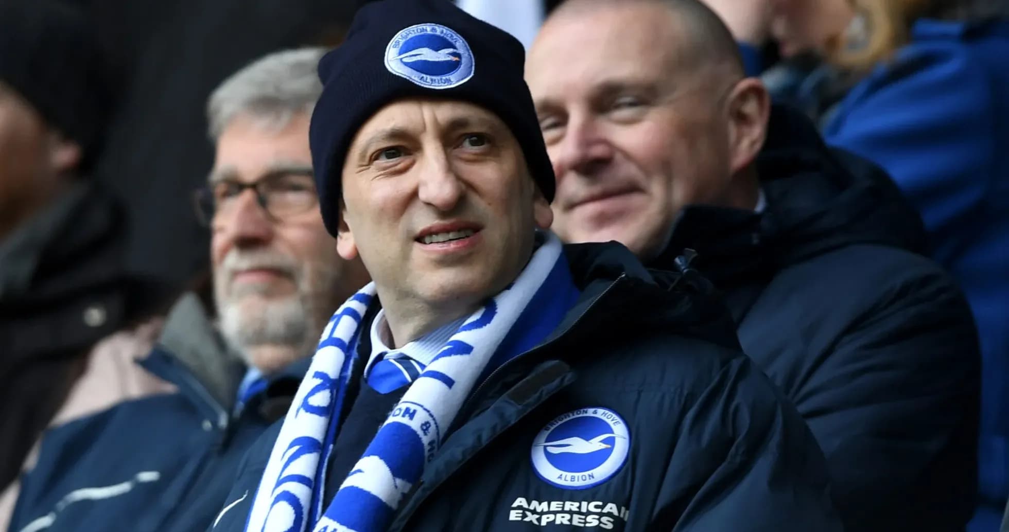Man wearing Brighton scarf and hat at match Man wearing Brighton scarf and hat at match