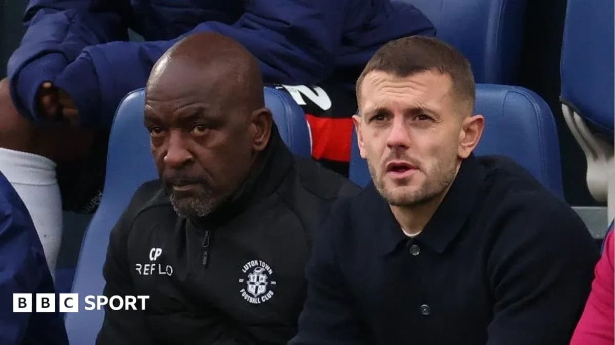 Luton Town staff sitting on bench during match Luton Town staff sitting on bench during match