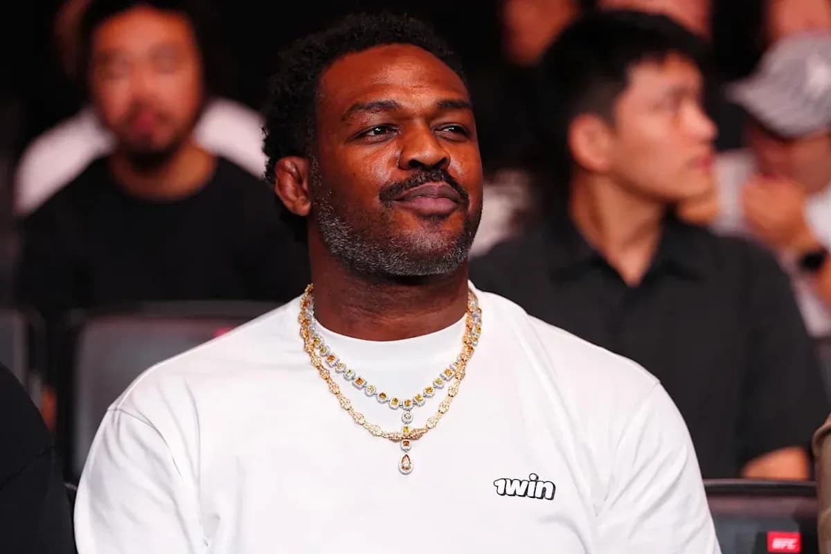 Man wearing jewelry at a sporting event Man wearing jewelry at a sporting event