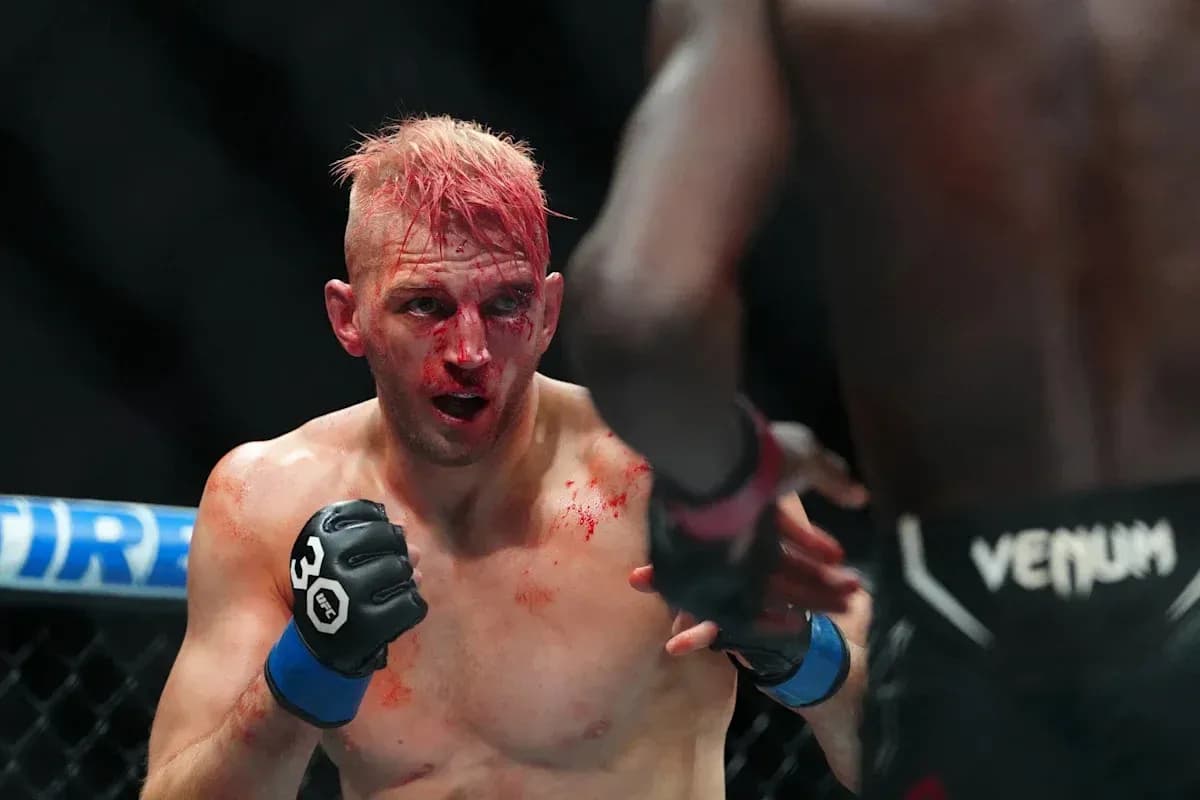 Fighter with blood on face during MMA match Fighter with blood on face during MMA match