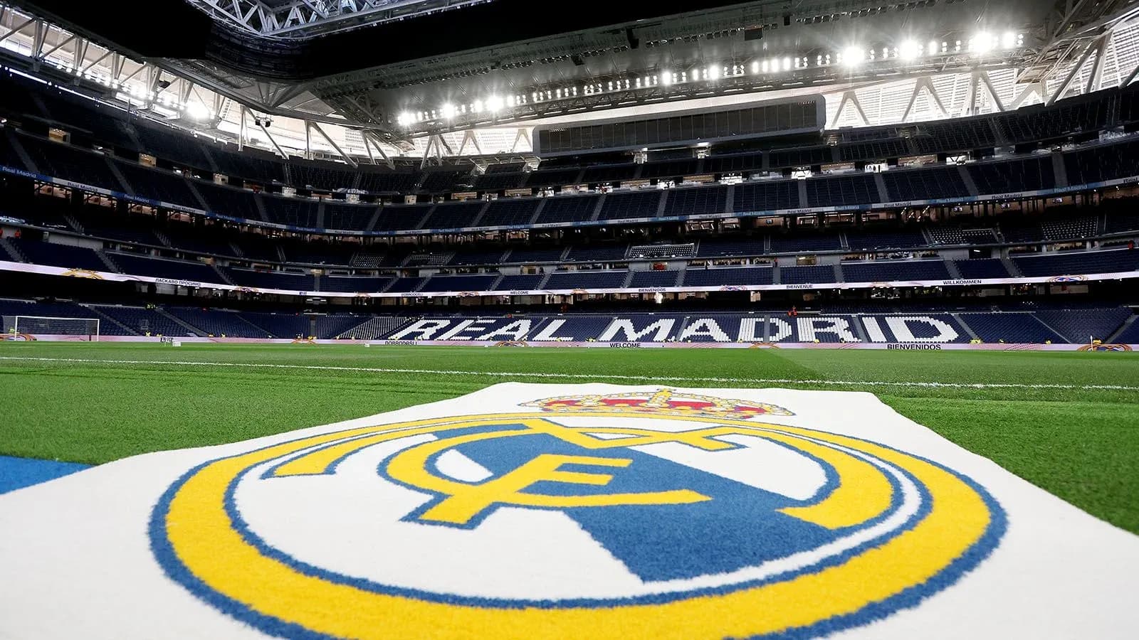 Real Madrid logo on the pitch inside stadium Real Madrid logo on the pitch inside stadium