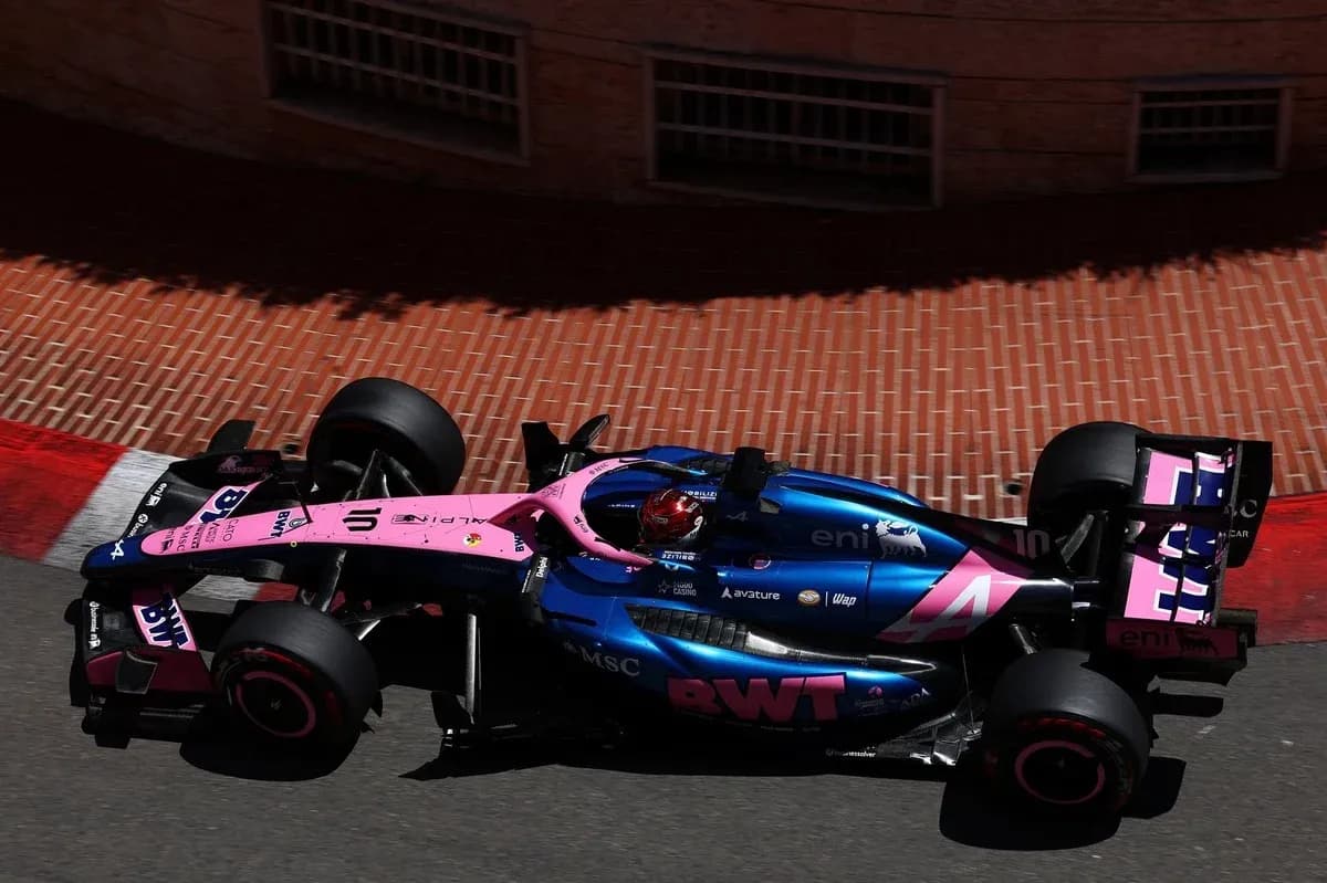 Race car navigating a turn on a street circuit Race car navigating a turn on a street circuit