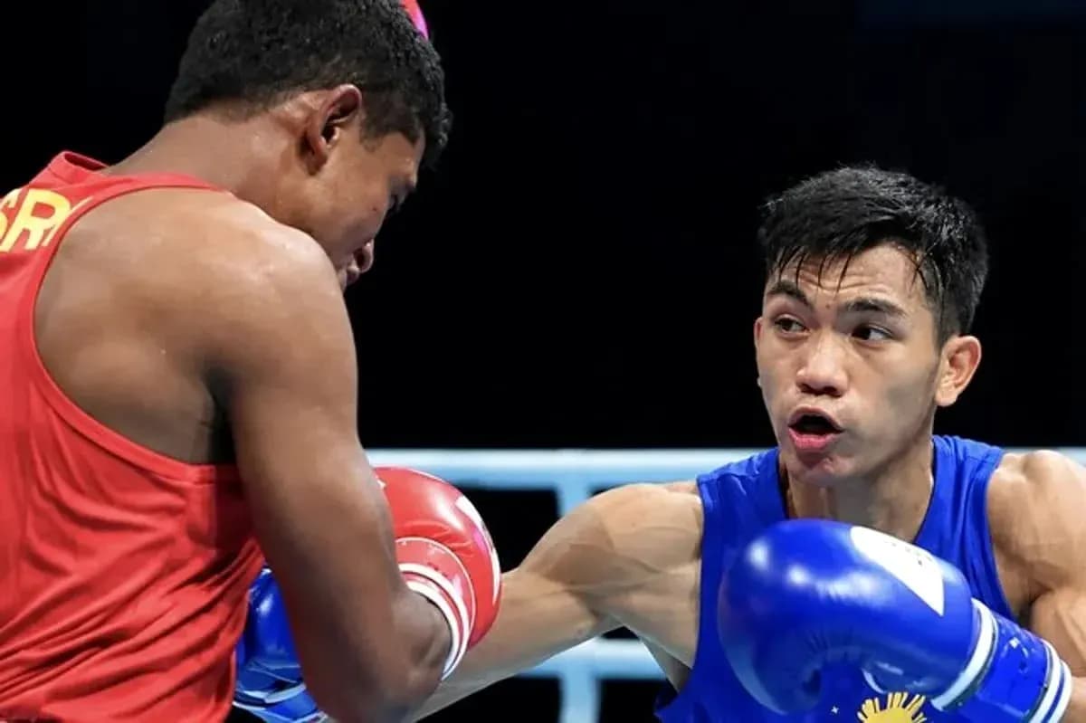 Two boxers competing in a match inside the ring Two boxers competing in a match inside the ring