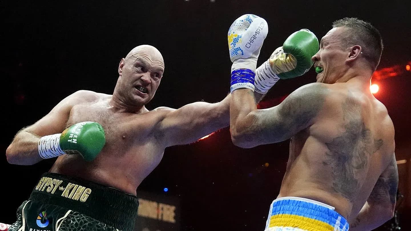 Boxers exchanging punches in a boxing match Boxers exchanging punches in a boxing match