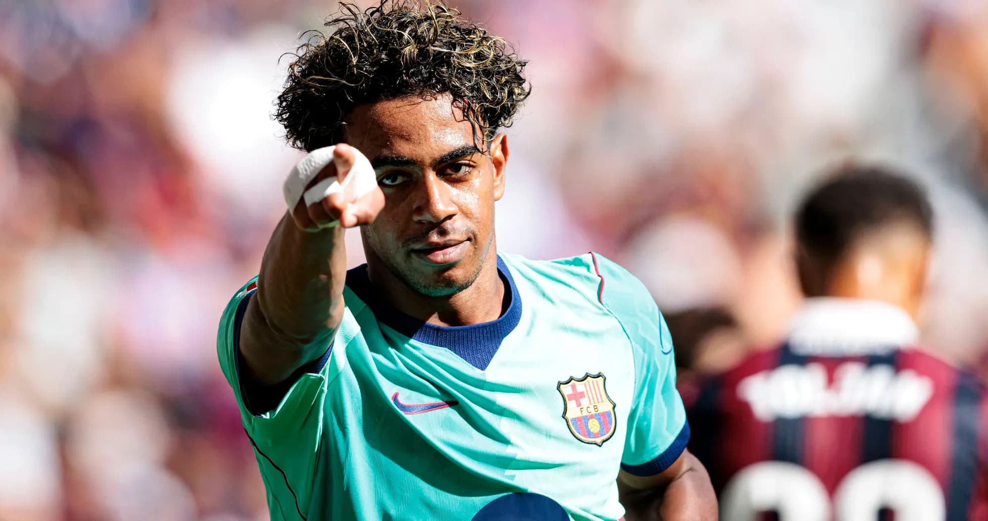 Barcelona player celebrating and pointing during match Barcelona player celebrating and pointing during match